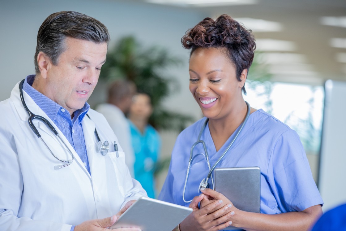 doctor and student looking over medical results