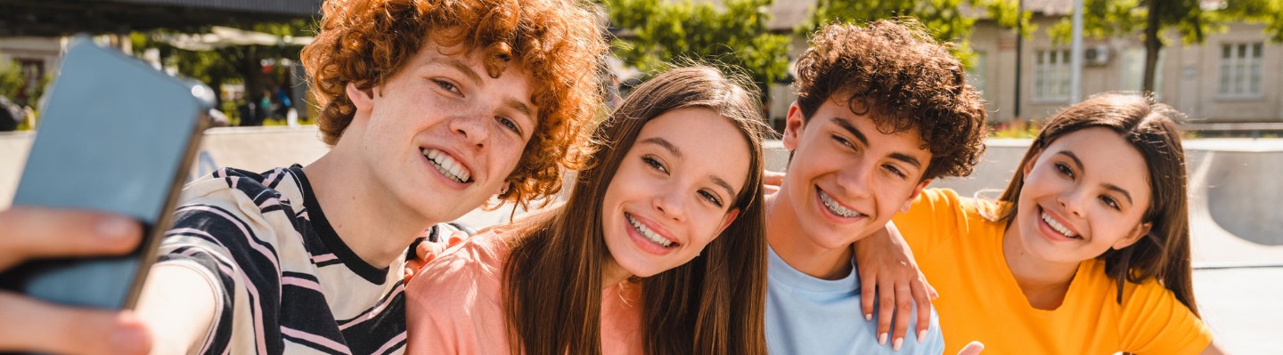 Teenagers taking a selfie.