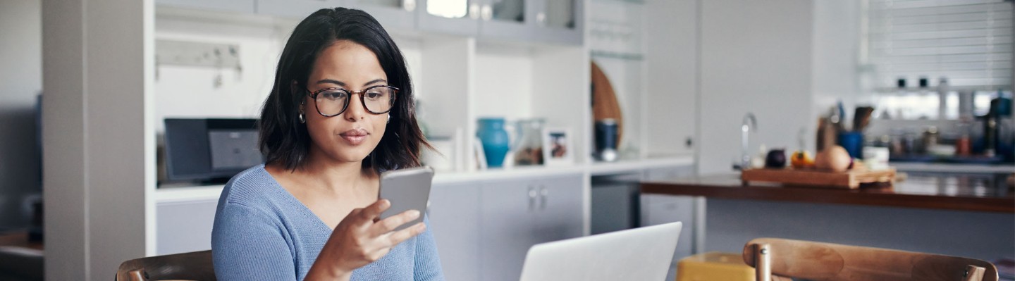 Young woman looking at cell phone.