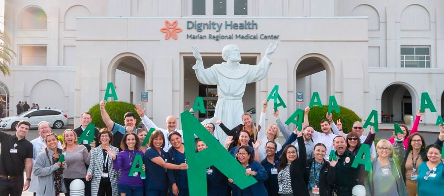 Marian Regional Medical Center workers holding up A signs