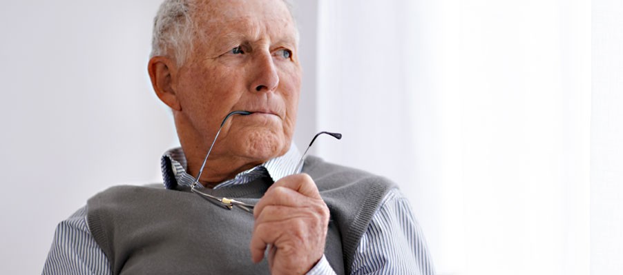 Senior man in deep thought looking off camera