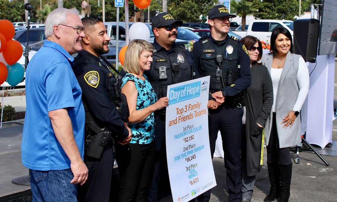 Members of the Santa Maria Police Department pose for a photo along with Day of Hope participants during Thursday's event which celebrated this year's record-breaking fundraising total.