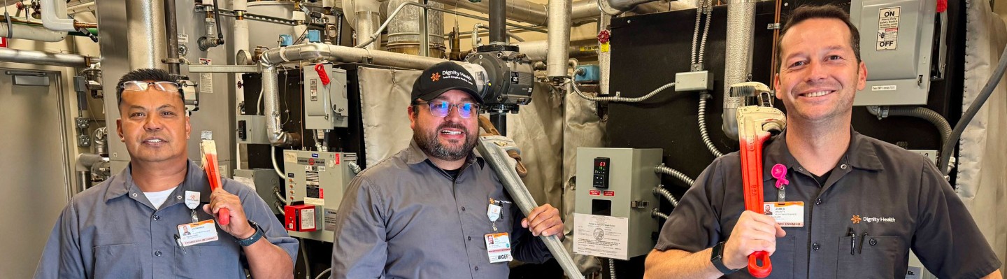 Eric Ruelas, center, French Hospital's Manager of Facilities Management, poses with team members, Leonardo Casabar, left, and James Brunty, right, inside the boiler room at the hospital in San Luis Obispo.