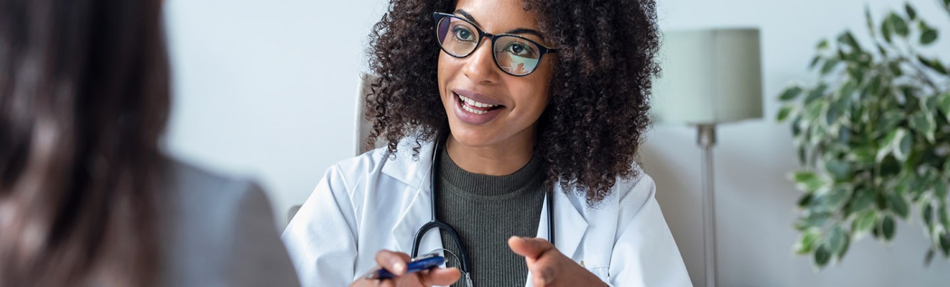 Physician speaking with patient