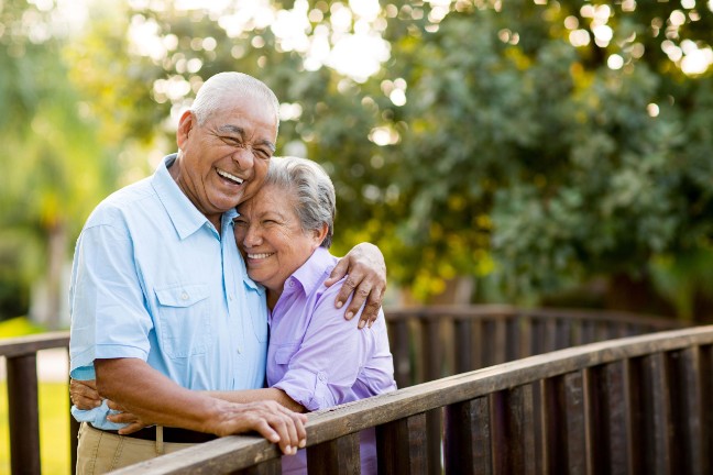 elderly couple playing tennis