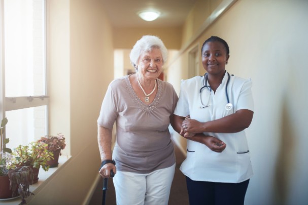 Image of a patient and doctor walking together
