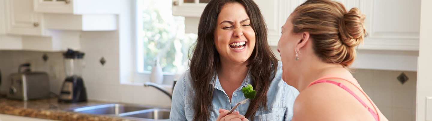 Two women laughing together