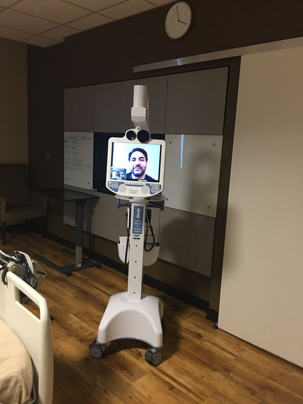 A medical team employs a telemedicine robot in an ICU at Westgate Medical Center