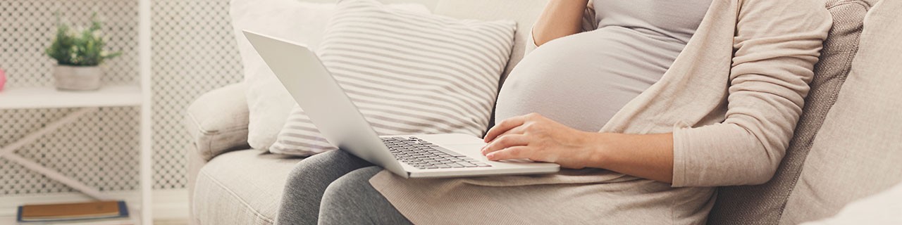Pregnant woman on laptop