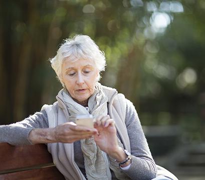 An older woman with a mobile phone