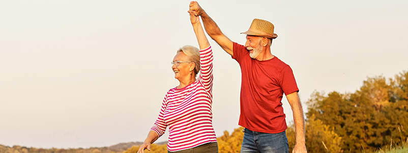 Older couple twirling around