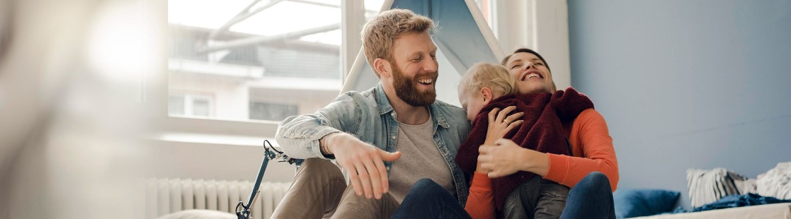 Family sitting together and hugging